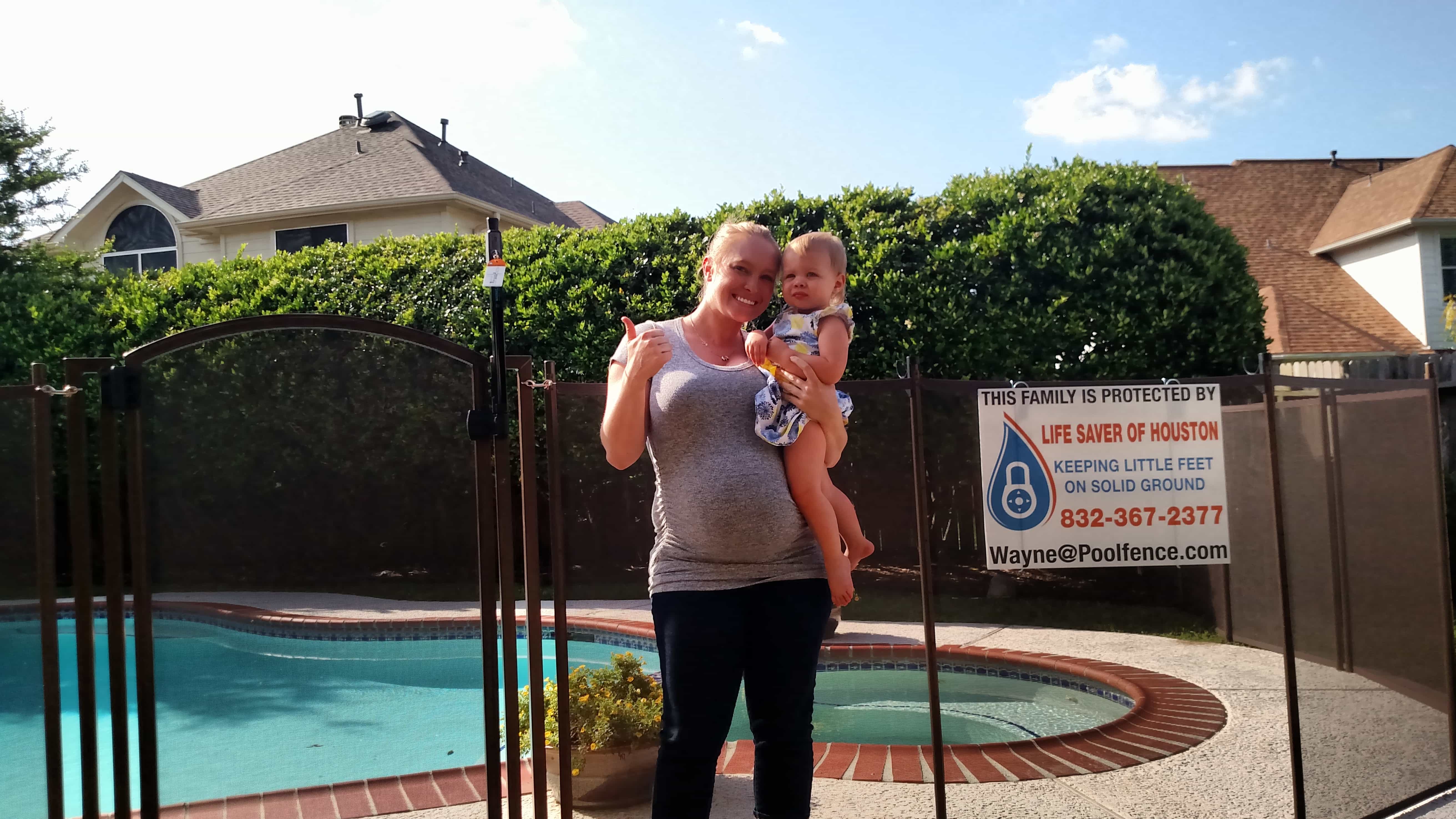 thumbs up to an above ground pool fence